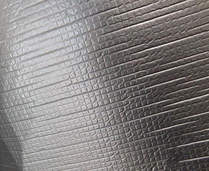Close-up texture of automotive self-adhesive sound deadener and heat insulation material